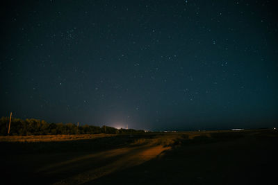 Scenic view of star field against sky at night