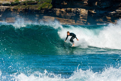 Man surfing in sea