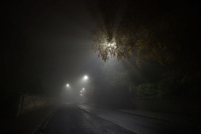 View of illuminated street at night