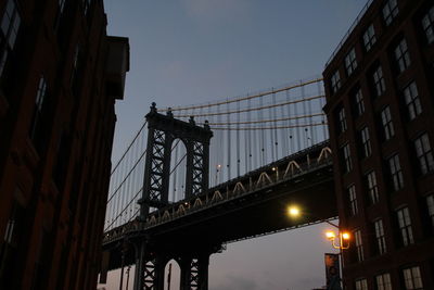 Low angle view of bridge against sky at night