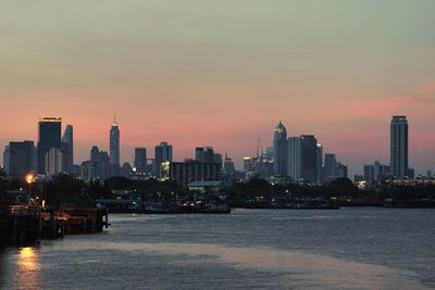 View of buildings in city during sunset