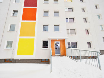 Low angle view of building covered with snow