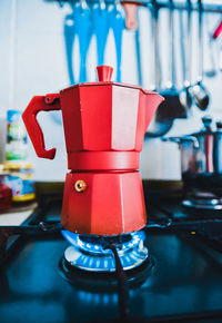 Close-up view of coffee pot on stove in kitchen