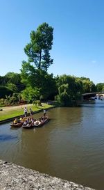 People on boat in river