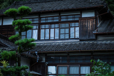 Low angle view of house and building against sky