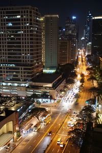 High angle view of illuminated city buildings at night