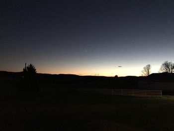 Scenic view of silhouette landscape against sky at sunset