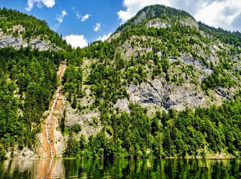 Panoramic view of river amidst mountains against sky