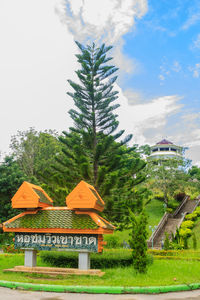 Trees and built structure against sky