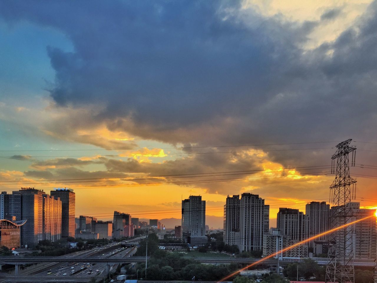 sunset, city, building exterior, architecture, built structure, cityscape, sky, skyscraper, orange color, cloud - sky, modern, tall - high, tower, office building, urban skyline, city life, cloud, cloudy, residential building, no people