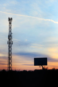 Low angle view of communications tower against sky