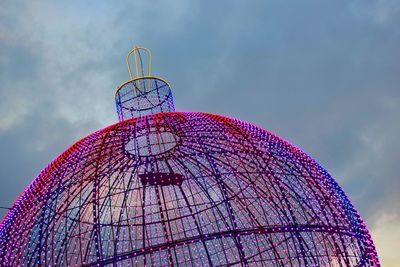 Low angle view of ferris wheel against sky