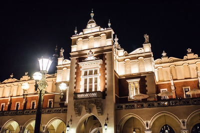 Low angle view of illuminated building at night