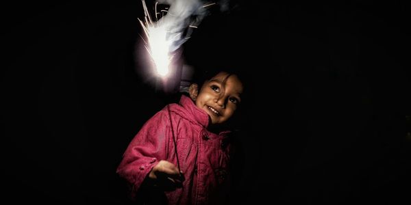 Portrait of smiling girl at night