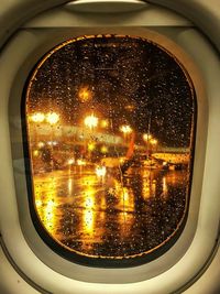 View of illuminated through airplane window