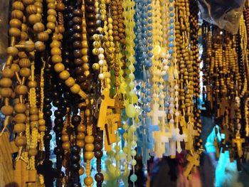 Close-up of rosary for sale in market