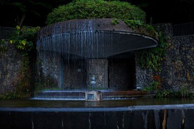 View of fountain against lake