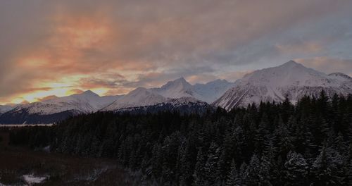 Scenic view of snowcapped mountains against sky during winter