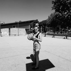 Full length of woman standing against sky