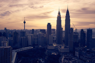 View of cityscape against sky during sunset