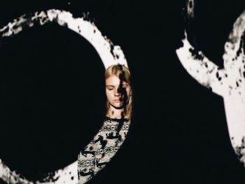 Portrait of female statue against sky at night