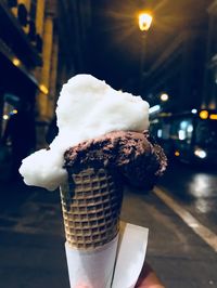 Close-up of ice cream cone at night