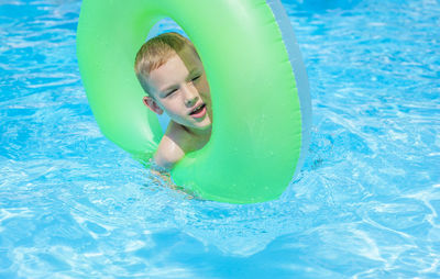 Portrait of boy in swimming pool