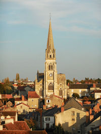 View of church in city against sky