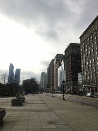 Buildings in city against sky