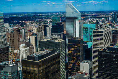 High angle view of buildings in city against sky