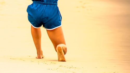 Low section of woman on beach