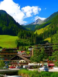 Scenic view of trees and mountains against sky