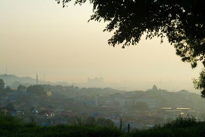 View of townscape against sky at dusk
