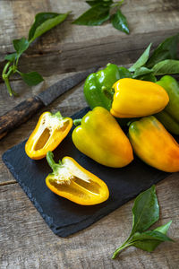 High angle view of yellow bell peppers on table