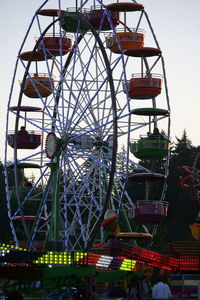 Low angle view of ferris wheel against sky