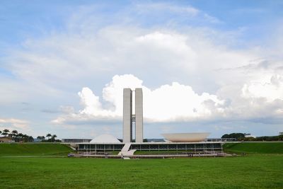 Built structure on field against sky