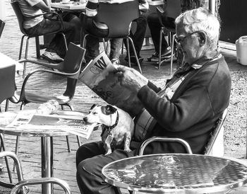 People sitting in front of woman