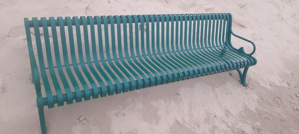 High angle view of empty chairs at beach
