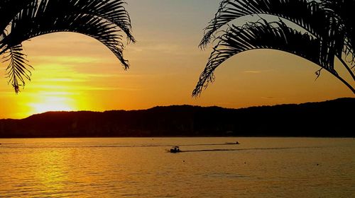 Scenic view of calm sea at sunset