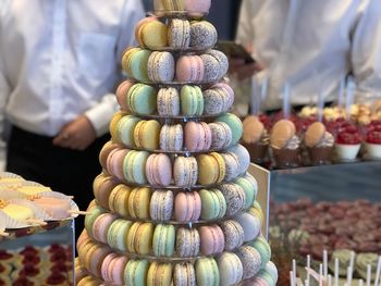 Stack of colorful macaroons for sale in store