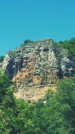 Scenic view of mountains against clear blue sky