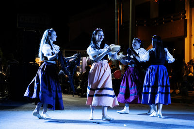 Teenager girls dancing italian traditional dance