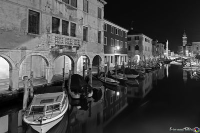 Boats moored in canal