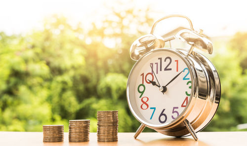 Close-up of clock on table