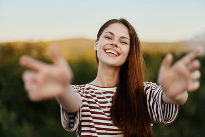 Portrait of young woman using mobile phone