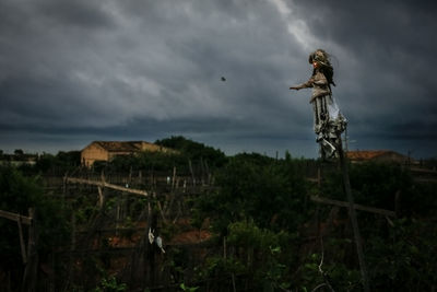 Scenic view of landscape against cloudy sky