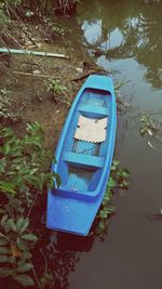 High angle view of boat floating on water