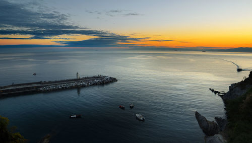 High angle view of sea against sky during sunset