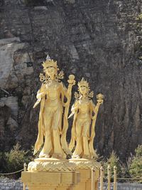 Statue of buddha against temple