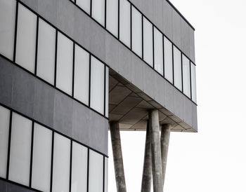 Low angle view of modern building against clear sky